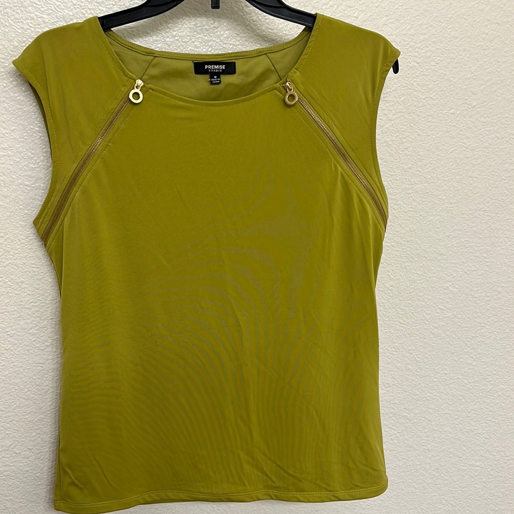 Green blouse with gold zipper detailing